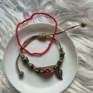 One floral bracelet and one seed bead bracelet